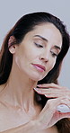 Hair, brush and mature woman in studio for grooming, wellness and routine on white background. Beauty, haircare and face of person with comb for healthy texture, growth and maintenance for split ends