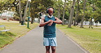 Fitness, music and watch with black man in park for start of cardio training, marathon or running. Exercise, monitor and time with mature athlete or runner person tracking progress of outdoor workout