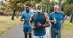 Senior, group and running with personal trainer at park for fitness, workout or cardio training in nature. Mature, people and runners with coach for physical activity, health and wellness in forest