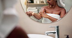Woman, body care and lotion with cosmetics, reflection and grooming for morning routine in bathroom. Person, mirror or dermatology for natural beauty, skin hygiene or hydration treatment in home