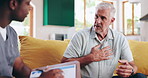 Nurse, mature man and discussion with checklist on sofa for healthcare, communication or consultation it home. Caregiver, advice and talking to elderly person for help, support and medical results