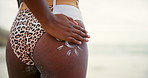 Butt, rubbing and sunscreen with woman on beach from back for holiday, travel or vacation. Behind, summer and sun shape with tourist person on coast of Australia to apply uv protection in summer