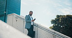 Black man, walking and travel with phone in city for corporate trip, commute or career opportunity. Businessman, employee or traveler with bag or mobile smartphone on staircase for job or immigration