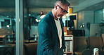 Man, phone call and reflection in office for business, financial advice and report on computer. Mature broker, glasses and tech at window for investment opportunity, audit deadline and communication