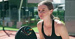 Sport, woman and playing padel on court for competition match, waiting on ball and game tournament. Tennis player, happy girl and racket for fitness exercise, club training and practice for challenge