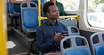Bus, travel and man with smartphone, thinking and message to contact, choice and social media. Person, student and guy with cellphone, public transport and mobile app with daydreaming and New York