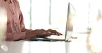 Closeup, hands and person with laptop for typing, finance report and research for investment portfolio. Office, employee and financial advisor with tech for corporate business, information and flare
