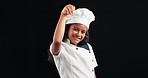 Girl, child and face with chef costume, smile and sprinkle spice with emoji by black background. Kid, happy and playful with sign, icon and symbol for development, funny and portrait in Costa Rica