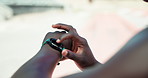 Person, fitness or hands with smart watch for workout app, training or checking performance at stadium. Closeup, athlete or runner with wristwatch or tracking step for health, heart rate or stopwatch