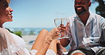 Happy, Interracial couple or cheers with champagne for vacation, summer holiday or date at luxury resort. Excited man, woman or lovers with smile or toast for drink, anniversary or honeymoon together