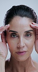 Skincare, hands and face of woman in studio for anti aging, cosmetics and wrinkle treatment. Dermatology, mature and portrait of person for beauty, wellness and glow of natural texture on background