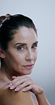 Skincare, touch and face of mature woman in studio for beauty, cosmetics and facial on white background. Dermatology, salon and portrait of person for natural skin, anti aging treatment and wellness
