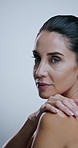 Skincare, touch and face of mature woman in studio for grooming, hygiene and wellness. Dermatology, spa and portrait of person with beauty for health, natural texture or hydration on white background