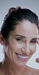 Skincare, mature and face of happy woman in studio for anti aging, cosmetics and wrinkle treatment. Dermatology, spa and portrait of person for beauty, natural texture and health on white background