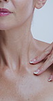 Hands, skincare and touch neck in studio with results, change and process for dermatology by background. Person, model and check for anti aging, beauty and wrinkles for cosmetics with natural glow