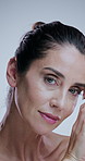 Skincare, dermatology and face of mature woman in studio for anti aging, cosmetics and wrinkle treatment. Spa, hands and portrait of person for beauty, facial or glow of natural texture on background