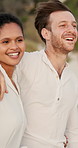 Walking, hug and happy couple at beach for romance, valentines day and love in interracial relationship. Sea, vacation or people bonding on holiday for romantic honeymoon, embrace and travel date
