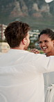Dancing, holding hands or happy couple at beach for valentines day, love or romance in interracial relationship. Sea, vacation or people celebrate on holiday for fun honeymoon, anniversary or date