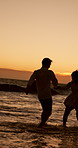 Water, sunset or couple at beach running for valentines day, love or romance fun in relationship. Night, vacation or people bonding on holiday for romantic honeymoon, care and travel date together