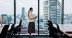 Japanese, business and woman on tablet in office for planning schedule, research and corporate checklist. Female person, window and digital for finance budget, investment feedback and proposal report