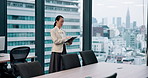 Business, woman and typing on tablet in office for planning schedule, research and corporate checklist. Female person, window and digital for finance report, investment feedback and proposal in Japan