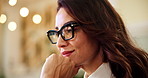Business woman, night and thinking with glasses for online booking or travel application at agency. Female person, consultant or reservation agent with smile, thought or wonder for trip or schedule