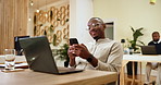 Business, smartphone and man in office, laptop and connection with research for article. Social media, people or employee in workplace, journalist or editor for magazine, internet or app for chatting