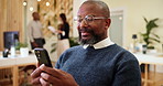 Business, typing and man in office, cellphone and connection with research for article. Smartphone, person and employee with internet, journalist and editor for magazine, social media and digital app