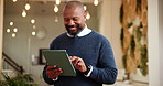 Office, black man and happy with tablet for web designer, software update and scroll for information. Business, mature and ux developer with tech for seo tools, trends or review for creative research