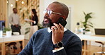 Phone call, smile and man in office, business and communication with planning. Employee, financial advisor and professional in workplace, cellphone and digital app for chatting and conversation