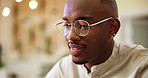 Office, black man and smile with glasses for reading, feedback and startup growth for business. Career, male person and designer with spectacles for review, satisfaction and happy for creative agency