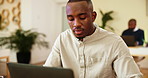 Black man, review and typing with laptop in office, news and proofreading for creative agency. Career, male person and journalist with digital for business story, editing and website for publication