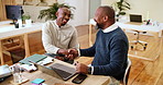 Happy, businessmen and handshake with laptop for deal, thank you or project agreement together at office. Male people, coworkers or shaking hands with computer for partnership, meeting or teamwork