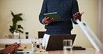 Business, meeting and person on tablet in office for company workshop, discussion and feedback. Professional, speaker and manager on digital tech for online notes, research and planning with audience