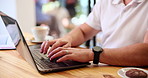 Business, hands and typing on laptop in cafe for email communication, online report and freelancing. Entrepreneur, man and technology in coffee shop for remote work, startup proposal and web research