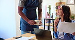 Coffee shop, waiter and woman on laptop with service for drink, beverage and cappuccino in cafe. Freelance consultant, remote work and person with documents for research, proposal and online project