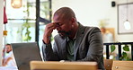 Stress, frustrated and businessman on laptop in cafe with debt problem, bad news and burnout for work crisis. Professional, corporate and African person for financial mistake, failure and deadline