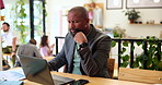 Businessman, laptop and thinking with documents at cafe for business analytics, performance or update. Man, freelancer and thoughtful analyst with computer or paperwork for statistics at coffee shop