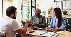 Cafe, meeting and business people with collaboration, b2b networking or interview discussion. Human resources, teamwork and coffee shop communication with technology for remote work project ideas