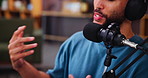 Happy man, hands and talk show with mic for podcast, live recording or online streaming at home studio. Closeup, male person or influencer with technology for news broadcast, radio or audio message