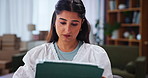 Box, small business and tablet with Indian woman in home office for freelance delivery or distribution. Laptop, logistics and online order with supply chain entrepreneur in apartment for remote work