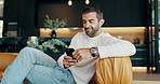 Relax, smile and phone with man on sofa for communication, social media and chat. Networking, conversation and connection with person and mobile in living room at home for scroll, online and post