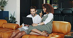 Relax, couple and laughing with laptop on sofa for online shopping, internet browsing and comedy blog. Interracial people, talking and smile in home with streaming subscription and funny conversation
