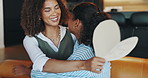 Mothers day, card and mom hug girl in home for bonding, relationship and thank you for gift. Family, love and happy parent with child embrace for affection, support and celebrate in living room
