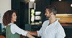 Interracial couple, dancing and laughing in home, happy and excited with memory, playful and bonding with love. Man, woman and smile for holding hands with loyalty, rhythm and together at apartment