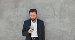 Business, wall and man with smartphone, typing and internet with communication. Person, lawyer and attorney with cellphone, outdoor or connection with digital app, website info or message to contact