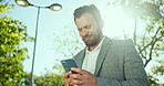 Business, cellphone and man in park, connection and internet with communication. Person, outdoor and entrepreneur with smartphone, nature or digital app with email, professional or message to contact