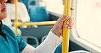 Person, hands and rail with bus for public transport, commute or travel in an urban town. Closeup, nurse or traveler with handle or pole in vehicle for trip, safety or security in city transportation