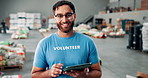 Volunteer, face and man with tablet in warehouse for food donation, inventory management or stock control for charity. Non profit, community service and person with digital app for grocery checklist