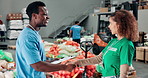 Happy people, volunteer or support with handshake for charity help or assistance at NGO warehouse. Man, woman or team shaking hands with smile for community service, social responsibility or donation
